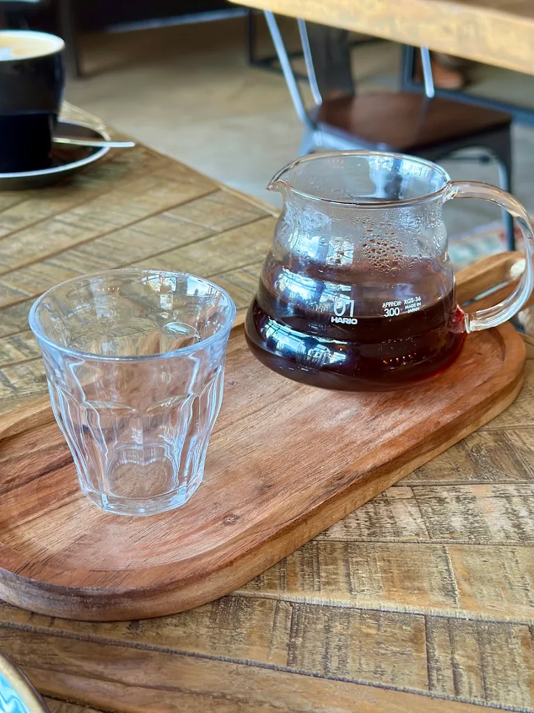 A V60 coffee carafe and glass served at Coffee Craft
